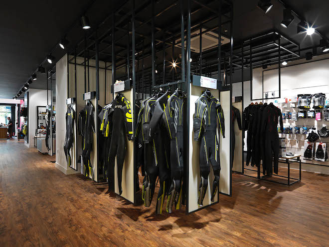 Trisuits hang in the retail interior